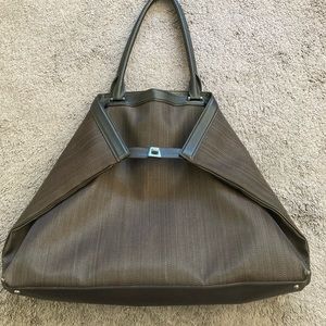 Large Akris handbag in horsehair with graphite colored hardware.